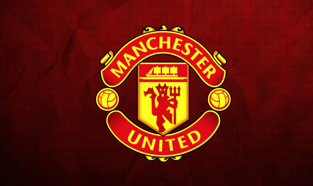 manchester united crest on a red background