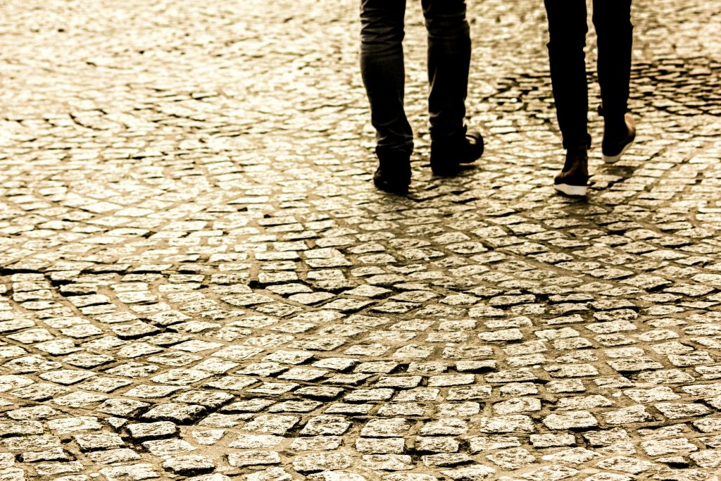 feet walking on cobbles